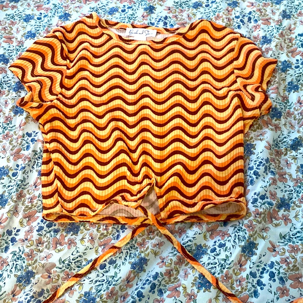 I am selling an indie style orange crop top.